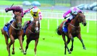 Jockey Ger Lyons guiding Treasuring (left) towards the victory in the Group three Qatar Racing & Equestrian Club (QREC) Curragh Stakes at the Curragh Racecourse in Ireland on Sunday.