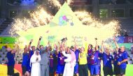 FC Barcelona Lassa players and officials celebrate with the IHF Super Globe Championship trophy after defeating Germany’s Fuchse Berlin in the final played at Duhail Sports Complex on Monday.