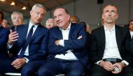 French employer’s body MEDEF union leader, Pierre Gattaz (centre), speaks with French Finance Minister, Bruno Le Maire (left), next to Emmanuel Faber, Chief Executive Officer of French food group Danone, at the MEDEF union summer forum at the campus of th