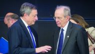Italy’s Finance Minister Pietro Carlo Padoan (right) and President of the European Central Bank Mario Draghi chat during an informal meeting of the Eurozone economic and financial affairs ministers (ECOFIN) in Tallinn, Estonia, yesterday. ECB President Ma