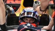 Red Bull's Dutch driver Max Verstappen sits inside his car during the third practice session of the Formula One Singapore Grand Prix in Singapore on September 16, 2017. / AFP / Mohd RASFAN
