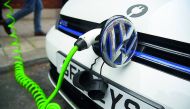 A file picture of an electric Volkswagen car plugged into a recharging point in central London.
