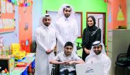 Officials of Nakilat give gifts to children at HGH. 