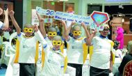 Children participating in the campaign “Heroes Come In All Sizes” organised by QCS to raise awareness about childhood cancer. 