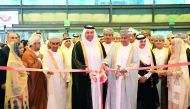 H E Sheikh Ahmed bin Jassim Al Thani (centre), Minister of Economy and Commerce and H E Dr Ali bin Masoud bin Ali Al Sunaidy (right), Minister of Commerce and Industry of Oman, cutting the ribbon to mark the opening of Omani Products Exhibition (OPEX) at 