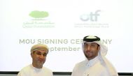 Officials of QF R&D and OTF during the signing ceremony. 