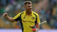 Australian batsman David Warner reacts while returning to the pavilion after being dismissed for 124 runs during the fourth one day international (ODI) match in the ongoing India-Australia cricket series at the M. Chinnaswamy Stadium in Bangalore on Septe