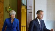 Britain's Prime Minister Theresa May arrives with Mark Carney, Governor of the Bank of England at an event to mark the 20th anniversary of the Bank's independence, in the City of London, September 28, 2017. Reuters/Mary Turner
