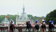 Jockey Frankie Dettori guides Enable (left) towards the victory in the Qatar Prix de l’Arc de Triomphe (Group 1) race at Chantilly Racecourse yesterday.