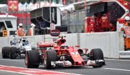 Ferrari's Finnish driver Kimi Raikkonen drives in the pit lane during the third practice session of the Formula One Japanese Grand Prix at Suzuka on October 7, 2017. / AFP / KAZUHIRO NOGI
