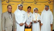 Qatar Post Chairman, Faleh Mohamed Al Naemi (right), with school students who won prizes in a letter-writing contest organised by Q-Post. The prizes were distributed on the eve of the World Post Day yesterday. Pic: Abdul Basit / The Peninsula 
