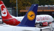 A Lufthansa airliner taxis next to the Air Berlin aircraft at Tegel airport in Berlin, Germany, October 12, 2017. REUTERS/Hannibal Hanschke
