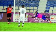 Al Rayyan player Mohssine Moutuali (left) scores from the penalty spot against Al Sadd in their QSL Cup yesterday.