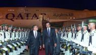 Emir H H Sheikh Tamim bin Hamad Al Thani is received at the Kuala Lumpur International Airport by Malaysia’s Minister of Defence Hishammuddin Hussein, yesterday. 