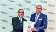 QIB Group CEO Bassel Gamal (right) receiving the Global Finance Award in Washington DC.
