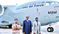 Qatar and Somalia officials standing in front of Emiri Air Force at the Mogadishu International Airport in Somalia, yesterday.