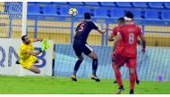 Umm Salal goalkeeper Basel Zaidan blocks a goal bound shot from Al Duhail striker Youssef El Arabi during their QNB Stars League match at Al Gharafa Stadium yesterday. Al Duhail won 4-1.  Pictures: Kammutty VP/The Peninsula 