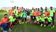 Delhi Dynamos players and officials pose for a picture with Barcelona and Spain legend Xavi during their training session at Aspire Academy in Doha on Thursday.