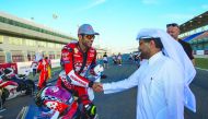 Qatari rider Saeed Al Sulaiti is congratulated by Qatar Motor and Motorcycle Federation (QMMF) President Abdulrahman Al Mannai at the Losail Circuit in Doha ahead of the WorldSBK Championship.