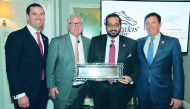 Qatar Racing and Equestrian Club (QREC) General Manager, Nasser bin Sherida Al Kaabi poses for a photograph with Breeders Cup Officials.