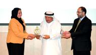 ALF Founder Sheikh Faisal bin Qassim Al Thani (centre), presenting a Tawasoul award to the head of one of the institutions yesterday in the presence of Ali Talal Al Marie, The Executive Director at ALF. Pic: Salim Matramkot / The Peninsula