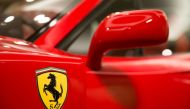 (FILES) This file photo taken on August 12, 2016 shows the Ferrari logo on a 1990 Ferrari F40.   AFP / Daniel LEAL-OLIVAS
