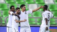 Al Sadd’s players celebrate a goal against Al Ahli during their QNB Stars League match at Khalifa Stadium yesterday. Al Sadd won the match 2-1.