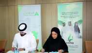 Officials of Injaz Qatar and NAMA Center at the signing of a memorandum of understanding.