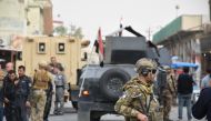 Police officers take security measures after a suicide bomber detonated his explosive vest in Atlas street in Kirkuk, Iraq on November 05, 2017. Ali Mukarrem Garip - Anadolu Agency