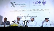 The Chairman of Tawar Mall, Jassim Jabor Sultan Tawar Al Kuwari (second left); Qatar Development Bank CEO, Abdulaziz bin Nasser Al Khalifa (second right); and other officials during the MoU signing at Tawar Mall yesterday. Pic: Kammutty VP / The Peninsula