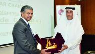 Ali Abdullatif Al Misnad (right), Board Member and Honorary Treasurer  at Qatar Chamber (QC), presenting a memento to India’s Ambassador to Qatar, P Kumaran, at Qatar Chamber  headquarters, yesterday.   
