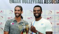 Al Rayyan’s star player Mubarak Dahi (left) and John Chigbo of Police pose with the Super Cup trophy after press conference held at the QVA premises in Doha on the eve of Super Cup clash yesterday. Pictures by: Salim Matramkot/The Peninsula