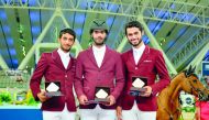 Mubarak Yousuf Al Rumaihi (centre), winner on day two of the third round of the 2017-18 Hathab Series poses for a picture along with other podium winners Salmen Sultan Al Suwaidi, and Nasser Al Ghazali, yesterday at the Al Shaqab Arena.