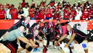 Victorious Al Rayyan team celebrate their Super Cup win against Police in Doha yesterday.  Picture: Salim Matramkot/The Peninsula