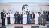 FROM LEFT: Alan Timbayan, Philippine Ambassador to Qatar; Dr Mohamed Ali Al Hajjaj, Head of OHS at SCH; Ramesh Prasad Koirala, Nepal Ambassador to Qatar; and other officials pose in front of the ‘Tamim Al Majd’ image during the awareness activities for wo