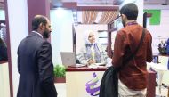 One of the Qatari exhibitors explaining their innovative product to a visitor at the Web Summit in Portugal.