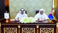 Adviser to the Minister of Interior, Major General Dr. Abdullah Yousuf Al Mal and Vice-President of Supreme Council of Police College and QU President Dr. Hassan Al Derham, sign the MoU.  
