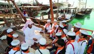 Students observing the tradition Dhow making tradition at the ongoing seventh Katara Traditional Dhow Festival at Katara Beach, yesterday. 