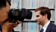 FILE PHOTO: Mark Karpeles (R), chief executive of defunct bitcoin exchange Mt Gox, attends a news conference after a trial on charges of embezzlement in Tokyo, Japan July 11, 2017.  REUTERS/Toru Hanai