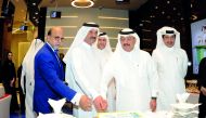 The officials of Doha Bank, Sheikh Fahad bin Mohammad bin Jabor Al Thani (second left), Chairman; Sheikh Abdul Rehman bin Mohammad bin Jabor Al Thani (second right), Managing Director; Dr R Seetharaman (left), Group CEO; jointly cutting a cake after the o
