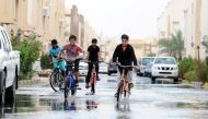 Children playing in rain water logged in a residencial compound in Al Wukair. Salim Matramkot © The Peninsula
