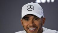 Mercedes' British driver Lewis Hamilton gestures during the drivers press conference ahead of the Abu Dhabi Formula One Grand Prix at the Yas Marina circuit on November 23, 2017.  AFP / GIUSEPPE CACACE
