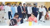 Indian Ambassador P Kumaran touring the medical camp with officials.