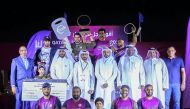 “Qatar’s Strongest Man” 2017 winner Abdulaziz Al Kuwari (second left, back row) with other participants and officials at the awarding ceremony which marked the conclusion of the event at Aspire Park last night.