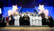Minister of Public Health H E Dr Hanan Mohamed Al Kuwari with the winners and other officials at the ceremony.