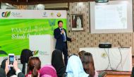 An official giving instructions to students at Qatar e-Nature Schools Contest. 