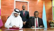 H E Khalifa bin Jassem Al Kuwari, Director General of the Qatar Development Fund and H E Jamal Mohammed Hassan, Minister of Planning, Investment and Economic Development, representing the Somali government, signing the agreement. 
