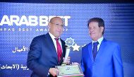 Dr. Omar El-Agnaf, Acting Executive Director of QBRI, receives the award. 