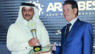 QEWC Public Relations and Shareholders Affairs Manager Rashid bin Nasser Al Hajri receiving the awards during the ceremony.