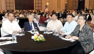 Philippine Ambassador Alan L Timbayan (second left), President of the Philippine Migrants Rights Watch, Carmelita Nuqui (right), and other officials at the International Forum on Migration in Qatar at InterContinental Doha yesterday. / Kammutty VP © The P